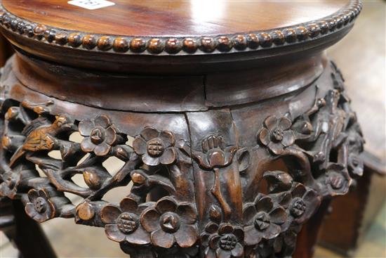 A pair of 19th century Chinese carved hardwood jardiniere stands